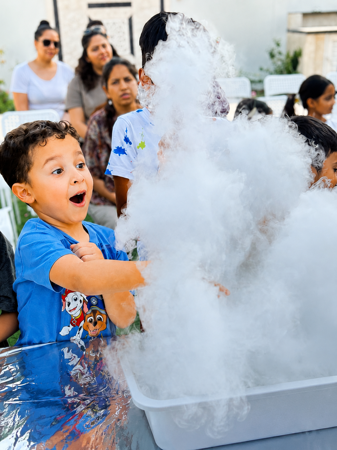 A young boy reacting with excitement during a Kids WHYverse event